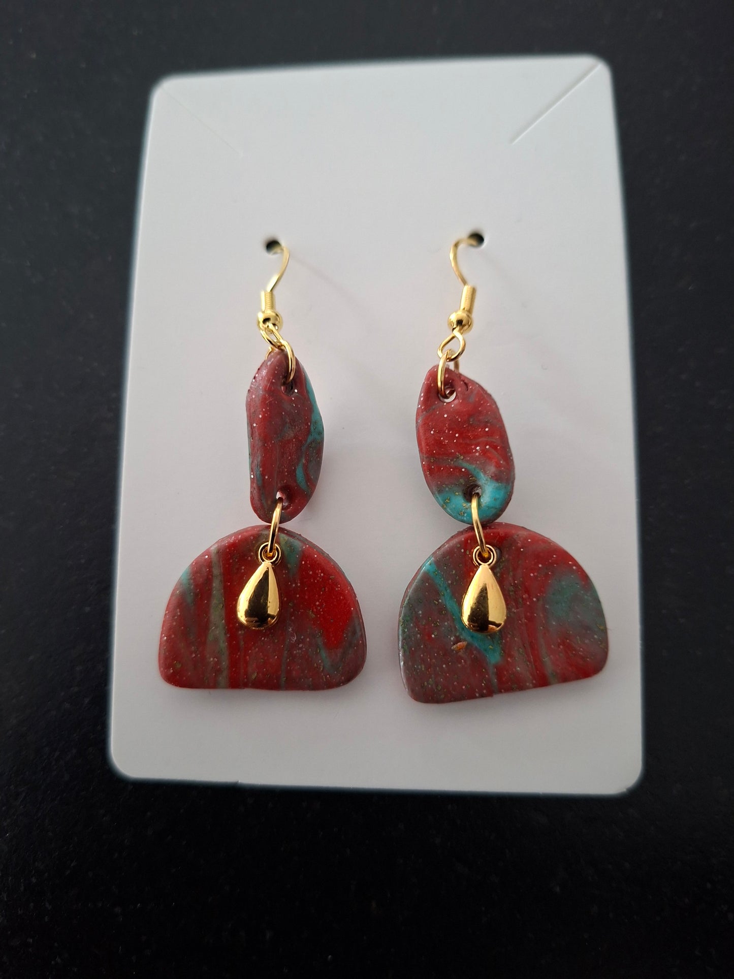 Rood / blauw met gouden parel