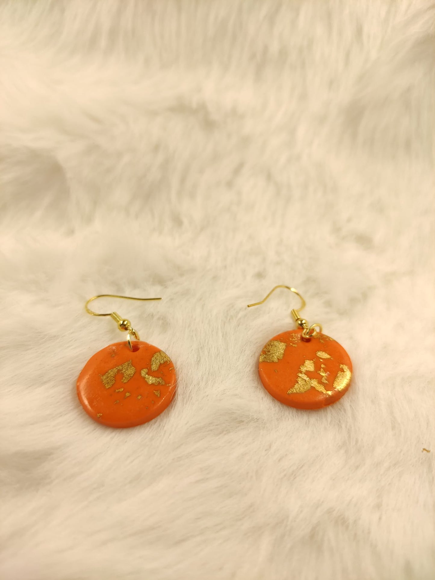 Oranje rondjes met goud