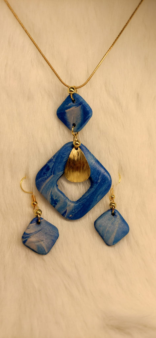 blauwe gemarmerde set oorbellen + ketting